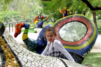 Sitting on the Niki de Saint Phalle sculptures at the Biblical Zoo