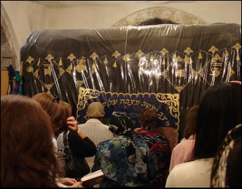 praying at Rachel's Tomb